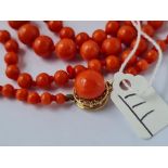 A graduated coral bead necklace with 14ct gold clasp - 23" long
