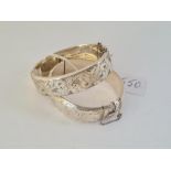 Two engraved wide silver bangles