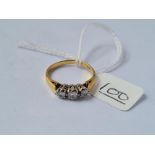 A 3 stone diamond ring in 18ct gold - size N.5 - 3.6gms