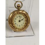 An antique ladies pocket watch with enamel back (missing glass) in 14ct gold 100