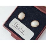 A pair of opal ear studs in 9ct