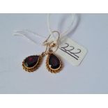 A pair of 9ct garnet circular drop earrings - 2.6gms