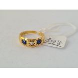 An attractive three stone sapphire & diamond ring in 18ct gold- size N - 5.4gms