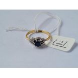 A 3 stone sapphire & diamond ring in 18ct - size O - 2.7gms