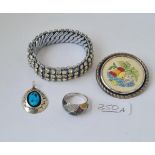 A silver turquoise pendant, a silver multi diamond ring, deco white paste stretch bracelet & an