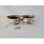 A pair of oval salts embossed with tied ribbons B'ham 1911 47 gms