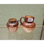 Two Doulton Lambeth jugs - 42 high