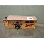 A Schuco tin plate garage with telephone - 6" long
