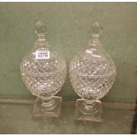 A pair of Adams style glass honey jars & covers on square bases - 9" high