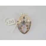 A silver pique a jour marcasite & pearl brooch