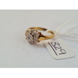 A diamond cluster ring in 18ct gold - size M - 3.7gms
