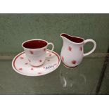 A Susie Cooper cup & saucer & a cream jug