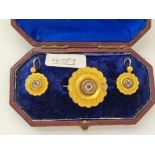 A VINTAGE CASED SET OF A TARGET BROOCH WITH RUBY'S & PEARL CLUSTER & MATCHING EARRINGS IN GOLD