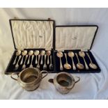 Two boxed sets of soup spoons and dessert eaters