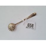 A Georgian bright cut salt spoon with shell bowl bottom marked by WS