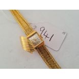 A VINTAGE NOMADO LADIES WRIST WATCH WITH SECRET HIDDEN CLASP IN 18CT GOLD WITH 18CT GOLD FANCY STRAP