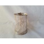 A Georgian style half pint mug with reeded handle and base 4 inches high Sheffield 1929 by M&W 182