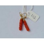 A pair of carved coral ear pendants - 2cm long