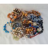 A bag of assorted costume jewellery