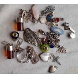 A bag of silver & other pendants etc.