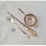 A late Victorian tea strainer with apostle handle B'ham 1899 a mustard spoon and a mounted button