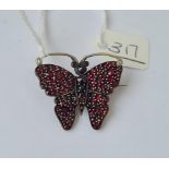 A antique garnet set butterfly brooch