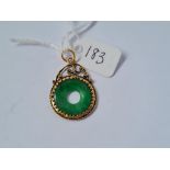 A circular gold & jade pendant - 1.3gms