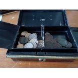 A cash tin of coins