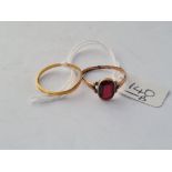 A Victorian wedding band in 22ct gold 1881- size O & a antique yellow metal garnet ring a/f