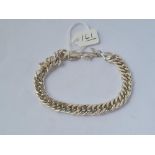 A silver curb link bracelet - 30gms