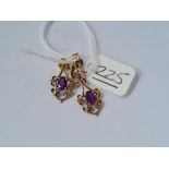 A pair of fancy amethyst earrings in 9ct - 2gms