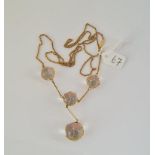 AN ANTIQUE ARTS & CRAFTS " POOLS OF LIGHT" NECKLACE - ROCK CRYSTAL SPHERES SET IN DELICATE GOLD CAGE