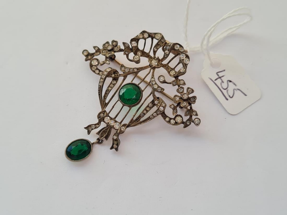 A vintage silver & paste pendant / brooch with green central stone