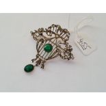 A vintage silver & paste pendant / brooch with green central stone