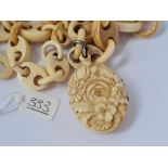 A Victorian carved locket & bone carved chain