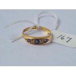 An attractive 9 stone blue & diamond ring set in high carat gold - size N - 2.7gms