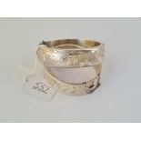 Two engraved wide silver bangles