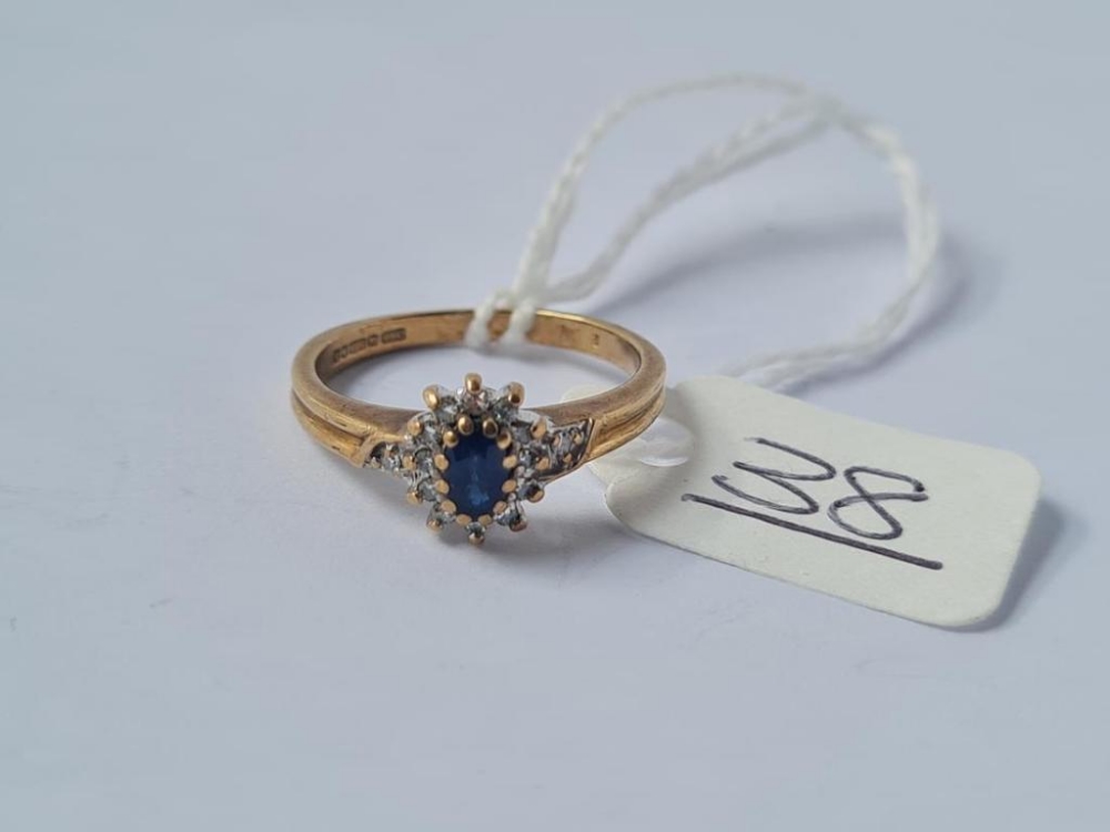 A sapphire cluster ring in 9ct - size K.5 - 2.3gms