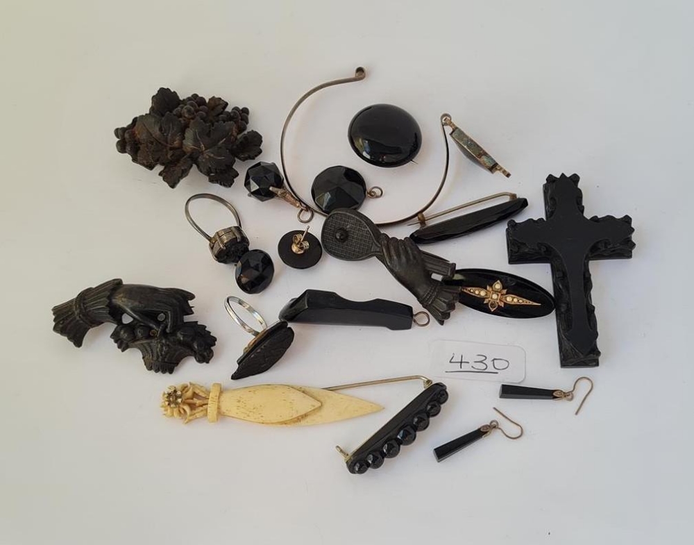 A bag of assorted black jewellery