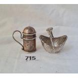 A small kitchen pepper and a Dutch boat shaped basket