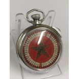 A vintage gaming pocket watch (when wound the mechanical arm spins round landing randomly on a