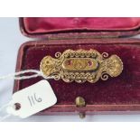 A boxed Victorian garnet brooch set in gold - 5gms