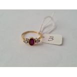 A good ruby & diamond 3 stone ring in 18ct gold - size P- 3gms