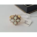 A OPAL & DIAMOND SNOW FLAKE RING IN 18CT GOLD - size O - 6.2gms