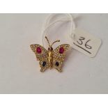 A PRETTY DIAMOND, RUBY & SAPPHIRE SET BUTTERFLY BROOCH IN 18CT GOLD - 3gms