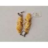 A pair of carved vine leaf dropped earrings