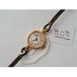 A ladies wrist watch in 9ct