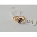 A Victorian high carat (tested) rock crystal & ruby cluster ring - size O.5 -