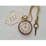 A ladies silver fob watch complete with key