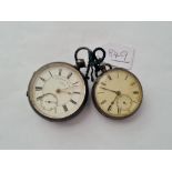 A pair of silver pocket watches